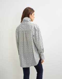 Model wearing Funnel neck shirt in check print