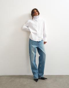 Model wearing Funnel neck shirt in white