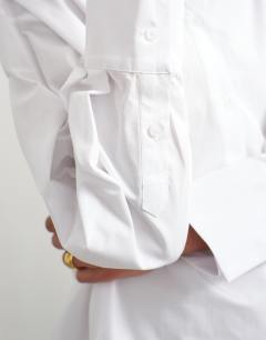 Model wearing Funnel neck shirt in white