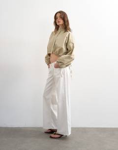 Model wearing Funnel neck tie detail shirt in stone