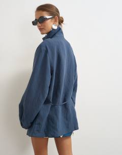 Model wearing Funnel neck tie detail top in navy self stripe