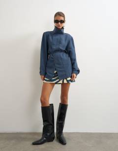 Model wearing Funnel neck tie detail top in navy self stripe