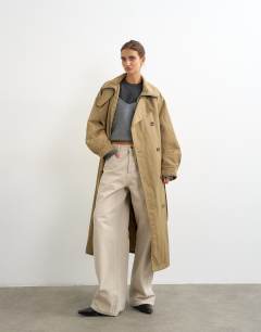 Model wearing Funnel neck trench in camel