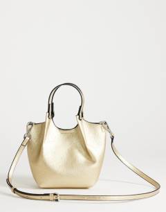 Model wearing Gabbie grab bag small with detachable cross body strap in gold