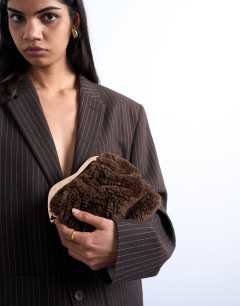 Model wearing Gabriette borg metal trim handle grab bag in brown