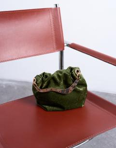 Model wearing Gabriette velvet metal trim handle grab bag in khaki