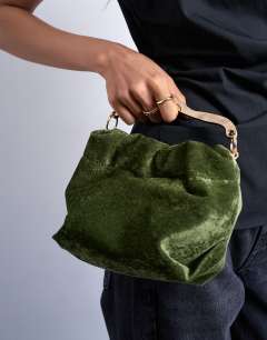 Model wearing Gabriette velvet metal trim handle grab bag in khaki
