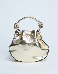 Model wearing Gabs ruched drawstring bell bag in gold