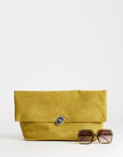 Model wearing Gaia oversized folded clutch bag with hardware in olive
