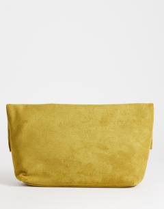Model wearing Gaia oversized folded clutch bag with hardware in olive