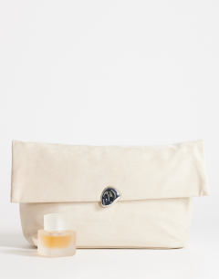 Model wearing Gaia oversized suedette clutch bag with hardware in beige