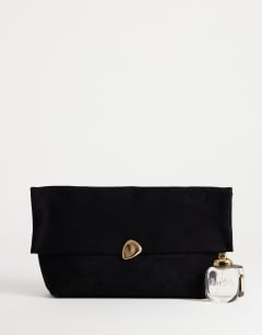 Model wearing Gaia suedette clutch bag with hardware in black