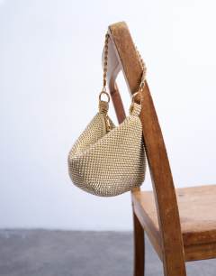 Model wearing Galaxy small diamante grab bag in gold