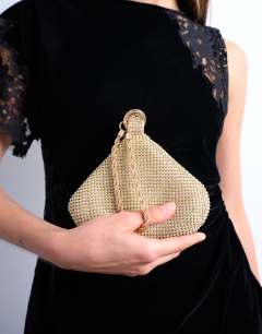 Model wearing Galaxy small diamante grab bag in gold