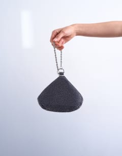 Model wearing Galaxy small diamante grab bag in navy