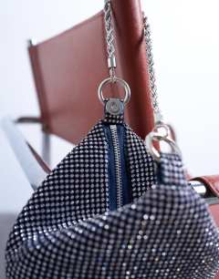 Model wearing Galaxy small diamante grab bag in navy