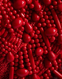 Model wearing Garison bead and embellished clutch in red
