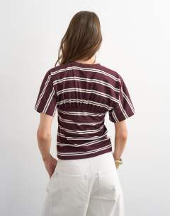 Model wearing Gather yoke seam short sleeve top burgundy stripe  