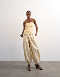 Model wearing Gathered bandeau top in buttermilk