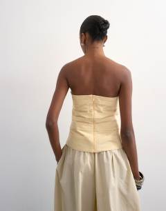 Model wearing Gathered bandeau top in buttermilk