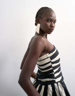 Model wearing Gathered bust bandeau with peplum hem in mono stripe