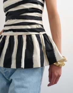 Model wearing Gathered bust bandeau with peplum hem in mono stripe