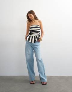 Model wearing Gathered bust bandeau with peplum hem in mono stripe