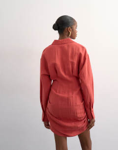 Model wearing Gathered skirt mini shirt dress in rust