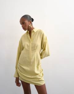Model wearing Gathered skirt mini shirt dress in yellow