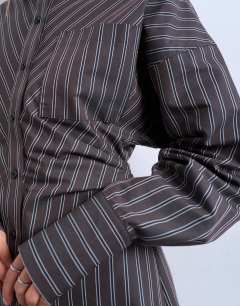 Model wearing Gathered waist long sleeve shirt dress in burgundy stripe