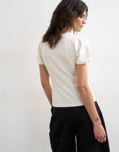 Model wearing Gathered yoke cap sleeve t-shirt in ecru