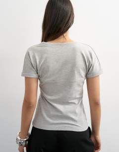 Model wearing Gathered yoke cap sleeve t-shirt in grey marl
