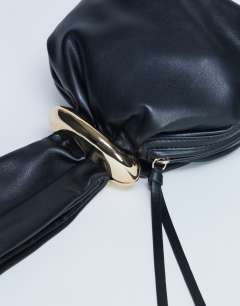 Model wearing Gee mini hardware grab bag in black