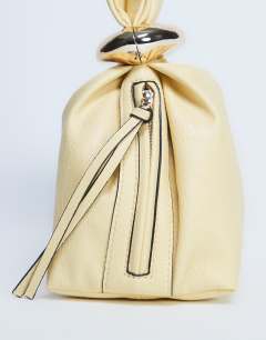 Model wearing Gee mini hardware grab bag in lemon