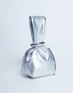 Model wearing Gee mini hardware grab bag in silver