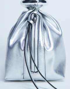 Model wearing Gee mini hardware grab bag in silver