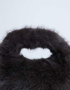 Model wearing Gemima faux fur grab bag in chocolate