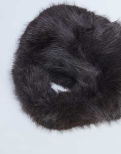 Model wearing Gemima faux fur grab bag in chocolate