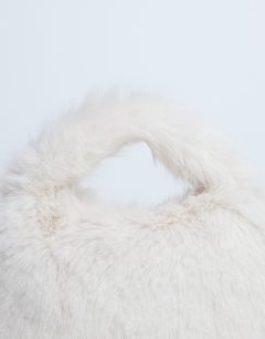 Model wearing Gemima faux fur grab bag in off white