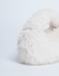 Model wearing Gemima faux fur grab bag in off white