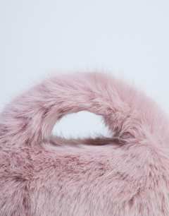 Model wearing Gemima faux fur grab bag in pink