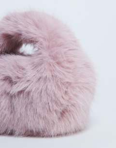 Model wearing Gemima faux fur grab bag in pink