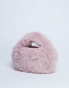 Model wearing Gemima faux fur grab bag in pink