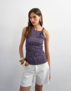 Model wearing Geometric print beaded tank in blue