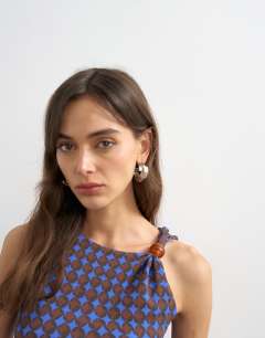 Model wearing Geometric print beaded tank in blue