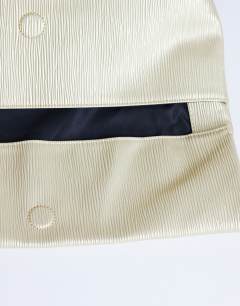 Model wearing George clutch bag in gold