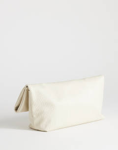 Model wearing George oversized textured clutch bag in off white