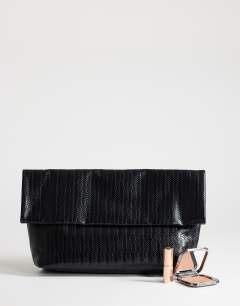 Model wearing George weave oversized clutch bag in black