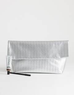 Model wearing George weave oversized clutch bag in silver