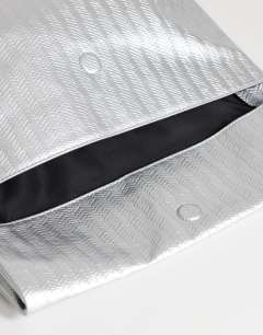 Model wearing George weave oversized clutch bag in silver